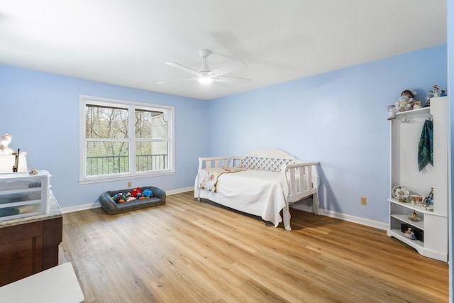 bedroom featuring light wood-type flooring and ceiling fan