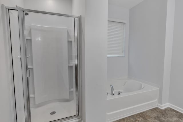 bathroom featuring tile patterned floors and plus walk in shower