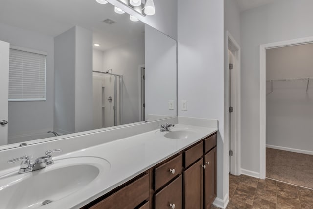 bathroom featuring vanity and independent shower and bath