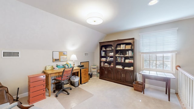 office with carpet flooring and vaulted ceiling