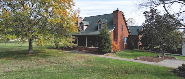 view of side of property with a lawn