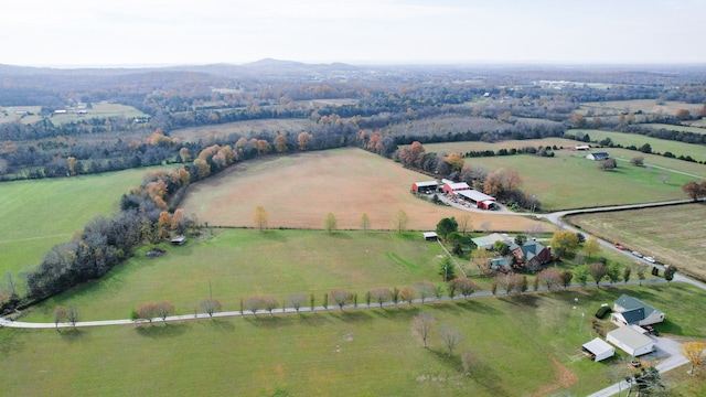 birds eye view of property featuring a rural view