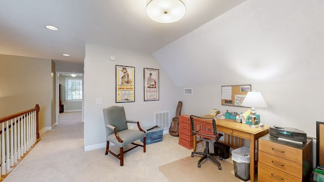 home office with light colored carpet and lofted ceiling