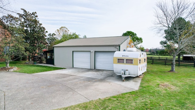 garage with a yard