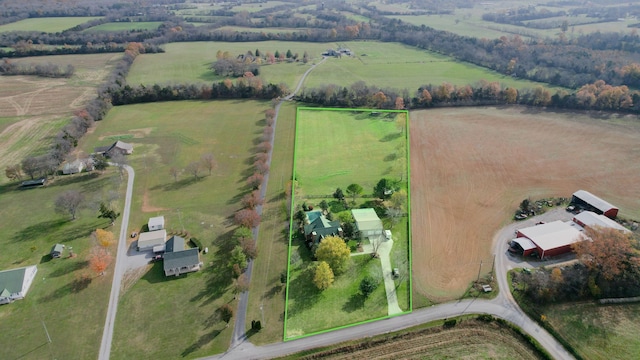 birds eye view of property with a rural view