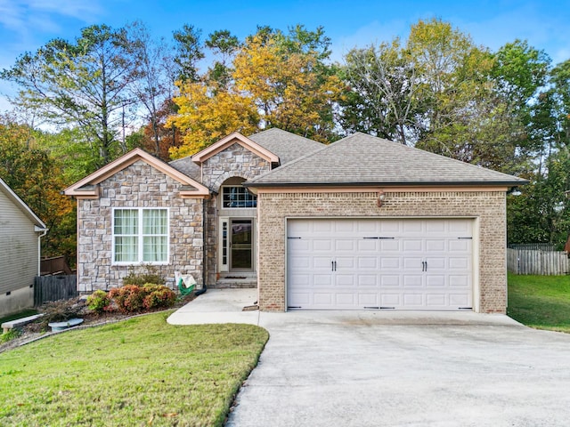 single story home with a front yard and a garage