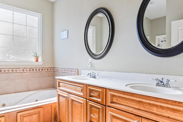 bathroom with a tub to relax in and vanity