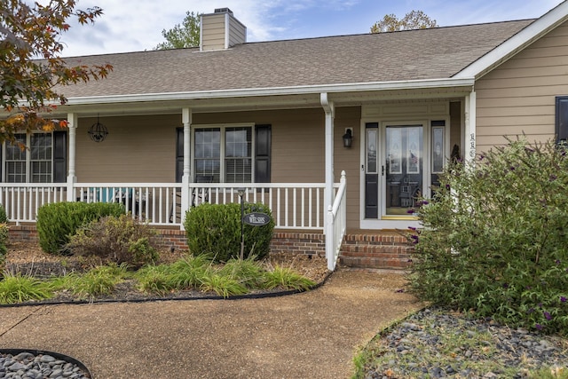 doorway to property with a porch