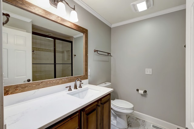 bathroom featuring vanity, toilet, a shower with door, and crown molding