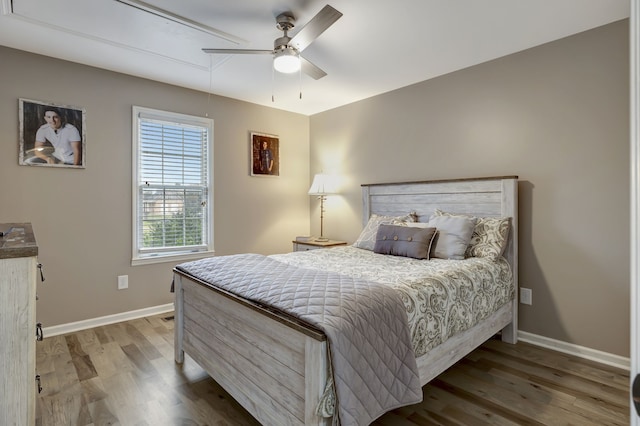 bedroom with ceiling fan and hardwood / wood-style floors