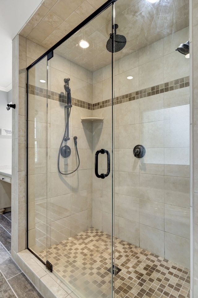 bathroom featuring a shower with door