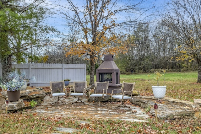 view of patio / terrace with exterior fireplace