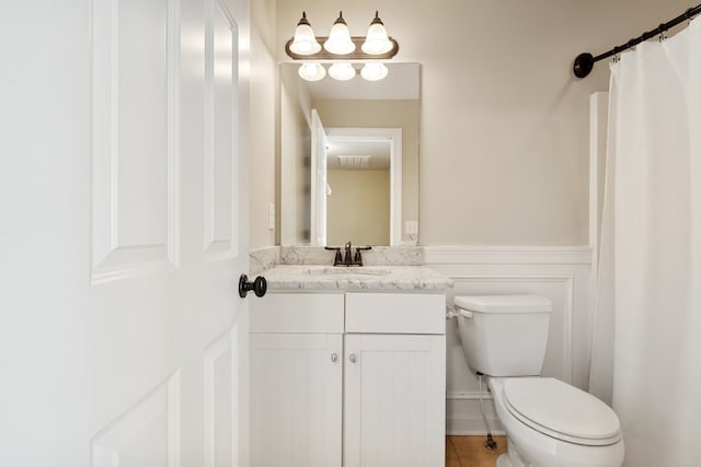 bathroom with tile patterned floors, vanity, and toilet