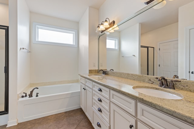 bathroom with shower with separate bathtub, vanity, and tile patterned floors