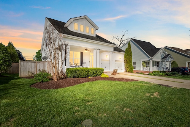 view of front of property with covered porch and a yard