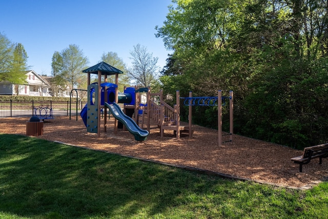 view of playground with a lawn