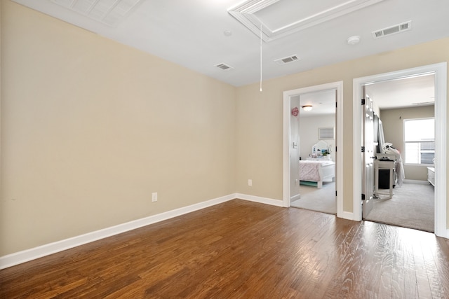 empty room with hardwood / wood-style flooring