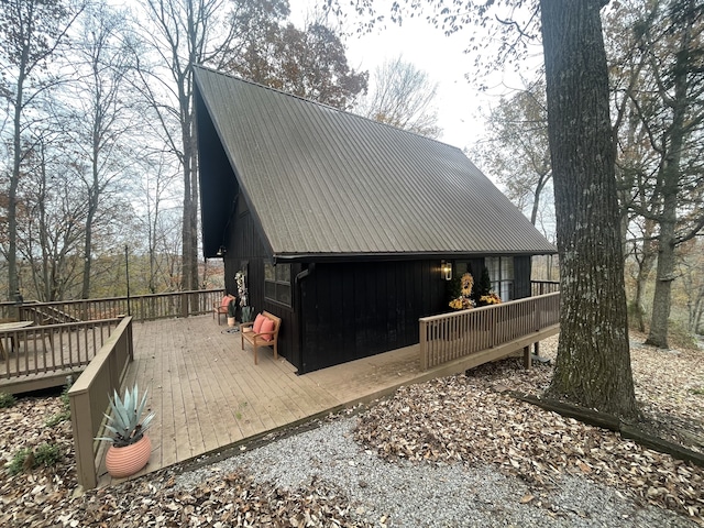 view of property exterior with a deck