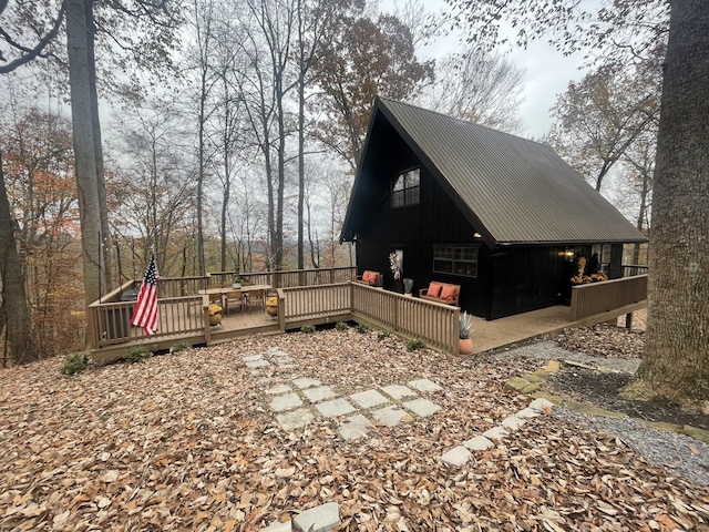2029 Holly Creek Rd, Celina, TN 38551 - view of side of home with metal roof and a wooden deck