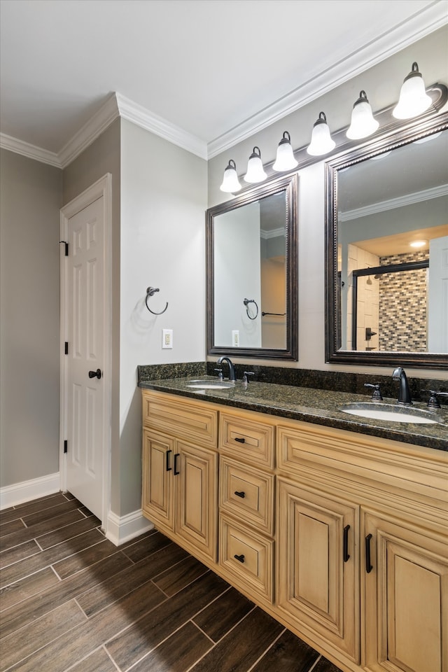 bathroom featuring ornamental molding, curtained shower, and vanity