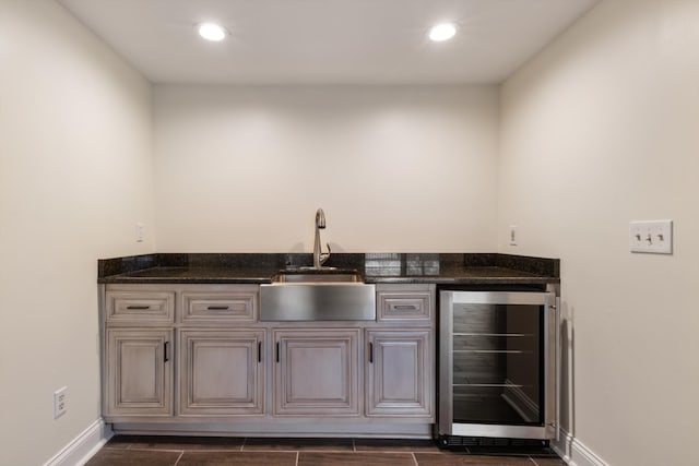 bar with sink and beverage cooler