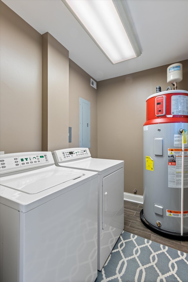 laundry area with separate washer and dryer, electric water heater, dark wood-type flooring, and electric panel