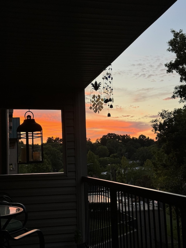 view of balcony at dusk