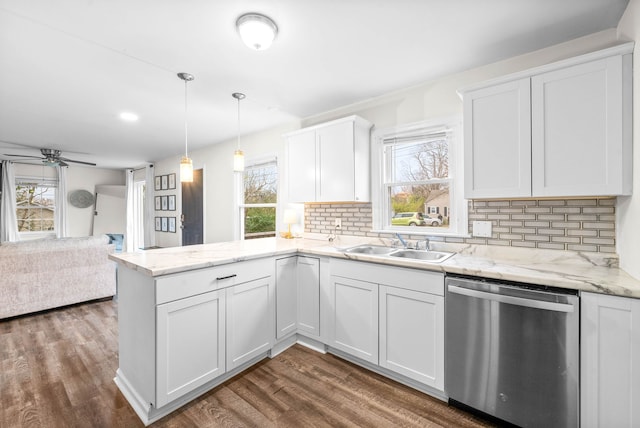 kitchen with white cabinets, dishwasher, decorative backsplash, and dark wood-type flooring