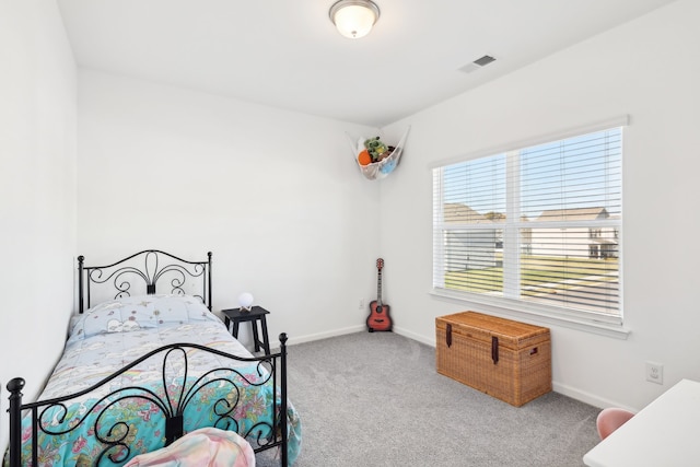 bedroom featuring light colored carpet