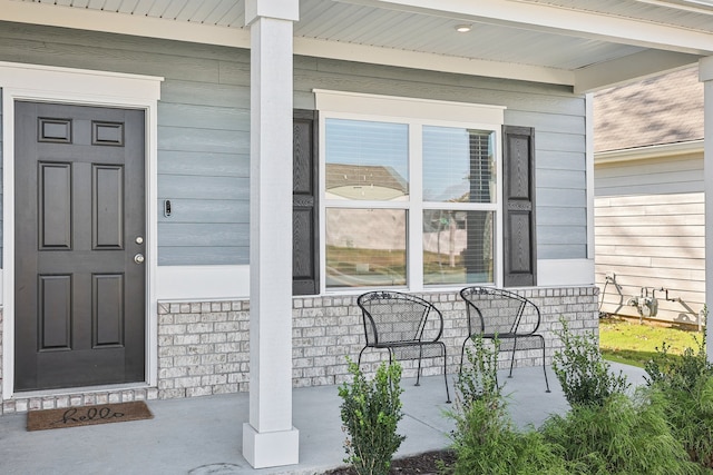 doorway to property with a porch