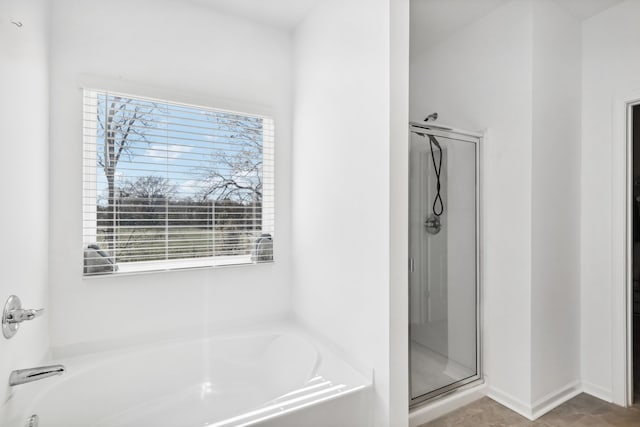 bathroom featuring separate shower and tub, tile patterned floors, and plenty of natural light