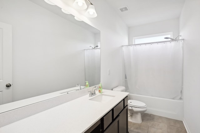 full bathroom featuring tile patterned flooring, shower / tub combo, vanity, and toilet