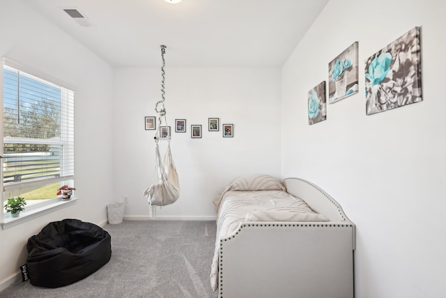 sitting room with carpet flooring and plenty of natural light