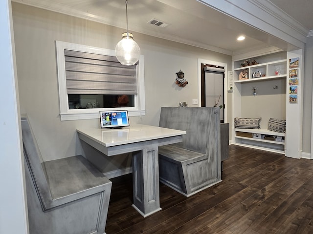 dining area with crown molding and dark wood-type flooring