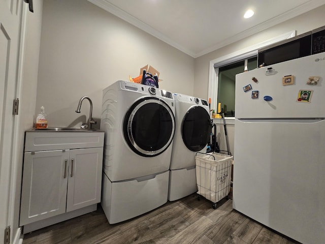 140 Dunn Fall River Rd, Leoma, TN 38468 - laundry area with washer and clothes dryer, crown molding, dark wood finished floors, recessed lighting, and cabinet space