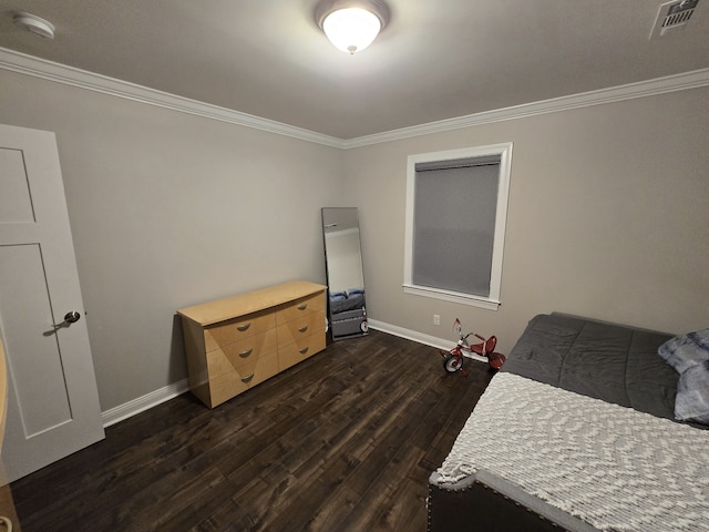 bedroom featuring dark hardwood / wood-style floors and ornamental molding