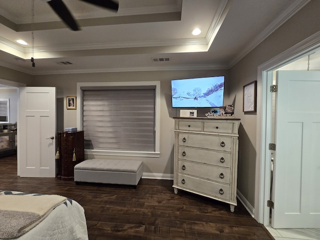 bedroom with a raised ceiling, ceiling fan, dark hardwood / wood-style flooring, and ornamental molding