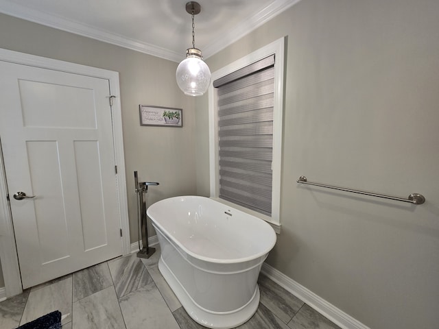 bathroom featuring ornamental molding and a tub