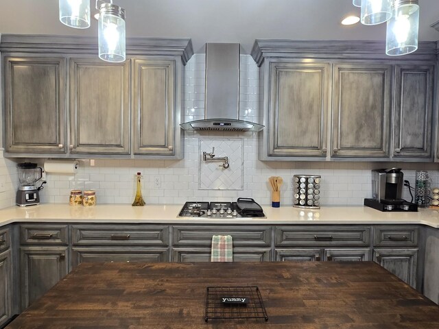 140 Dunn Fall River Rd, Leoma, TN 38468 - kitchen with wall chimney range hood, stainless steel gas stovetop, decorative backsplash, and gray cabinets