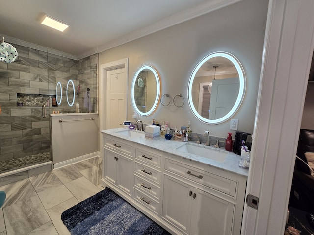 bathroom with vanity, ornamental molding, and walk in shower