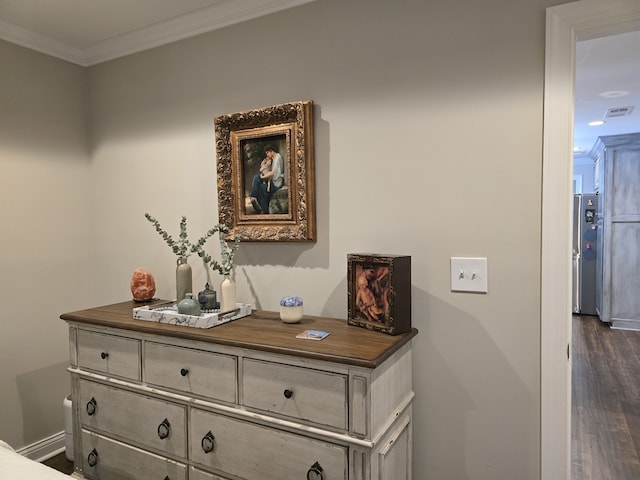 interior details with wood-type flooring and ornamental molding