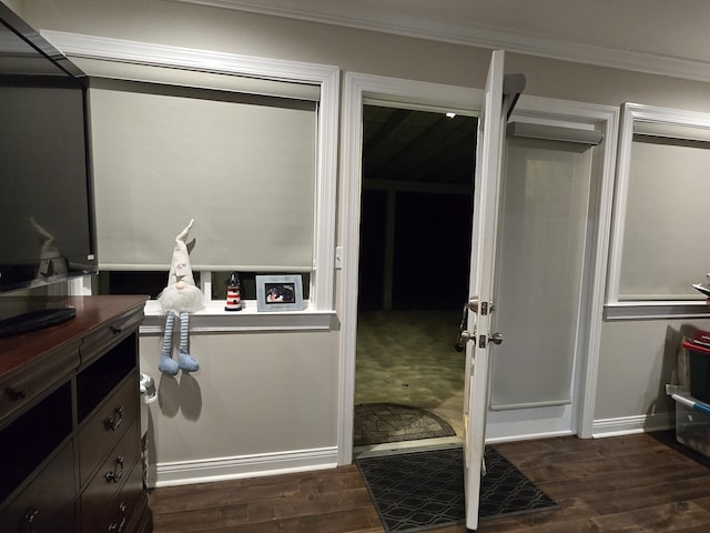 bathroom with hardwood / wood-style flooring and ornamental molding