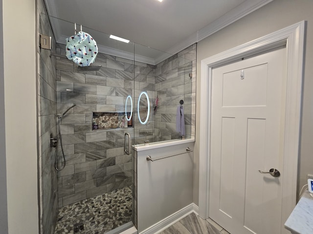 bathroom featuring hardwood / wood-style floors, a shower with shower door, and crown molding