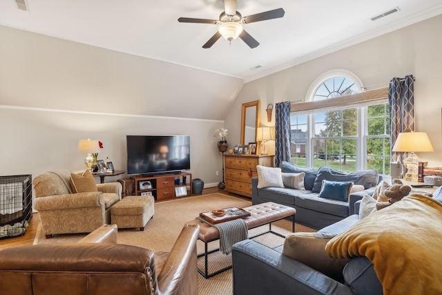 living room featuring carpet, ceiling fan, vaulted ceiling, and crown molding