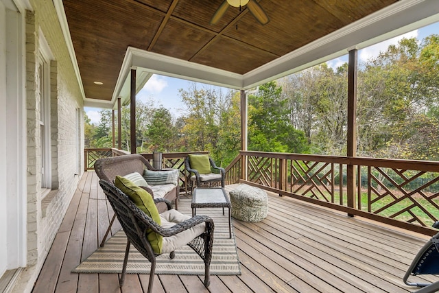 wooden terrace featuring ceiling fan