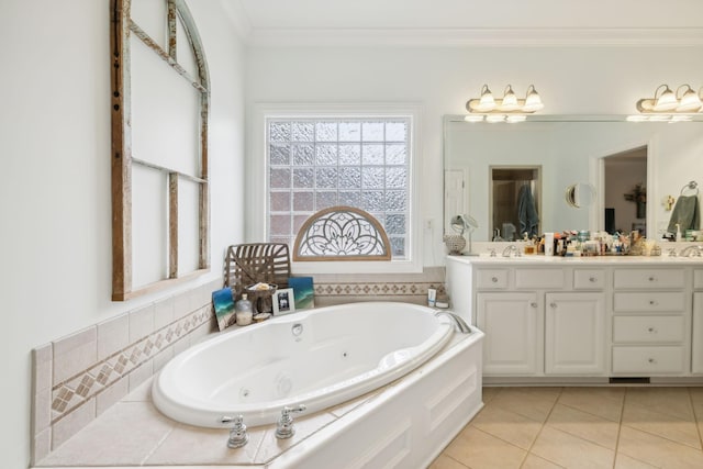 bathroom featuring a bathtub, vanity, tile patterned flooring, and crown molding