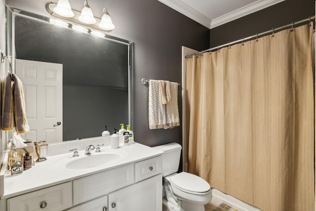 bathroom with toilet, crown molding, and vanity