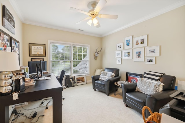 carpeted home office with ceiling fan and crown molding