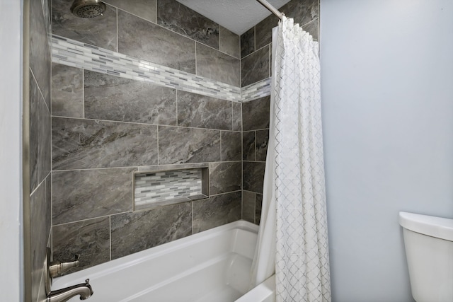 bathroom featuring toilet and shower / tub combo