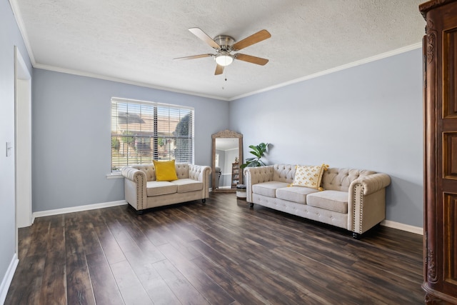 living room featuring dark hardwood / wood-style floors, ceiling fan, ornamental molding, and a textured ceiling